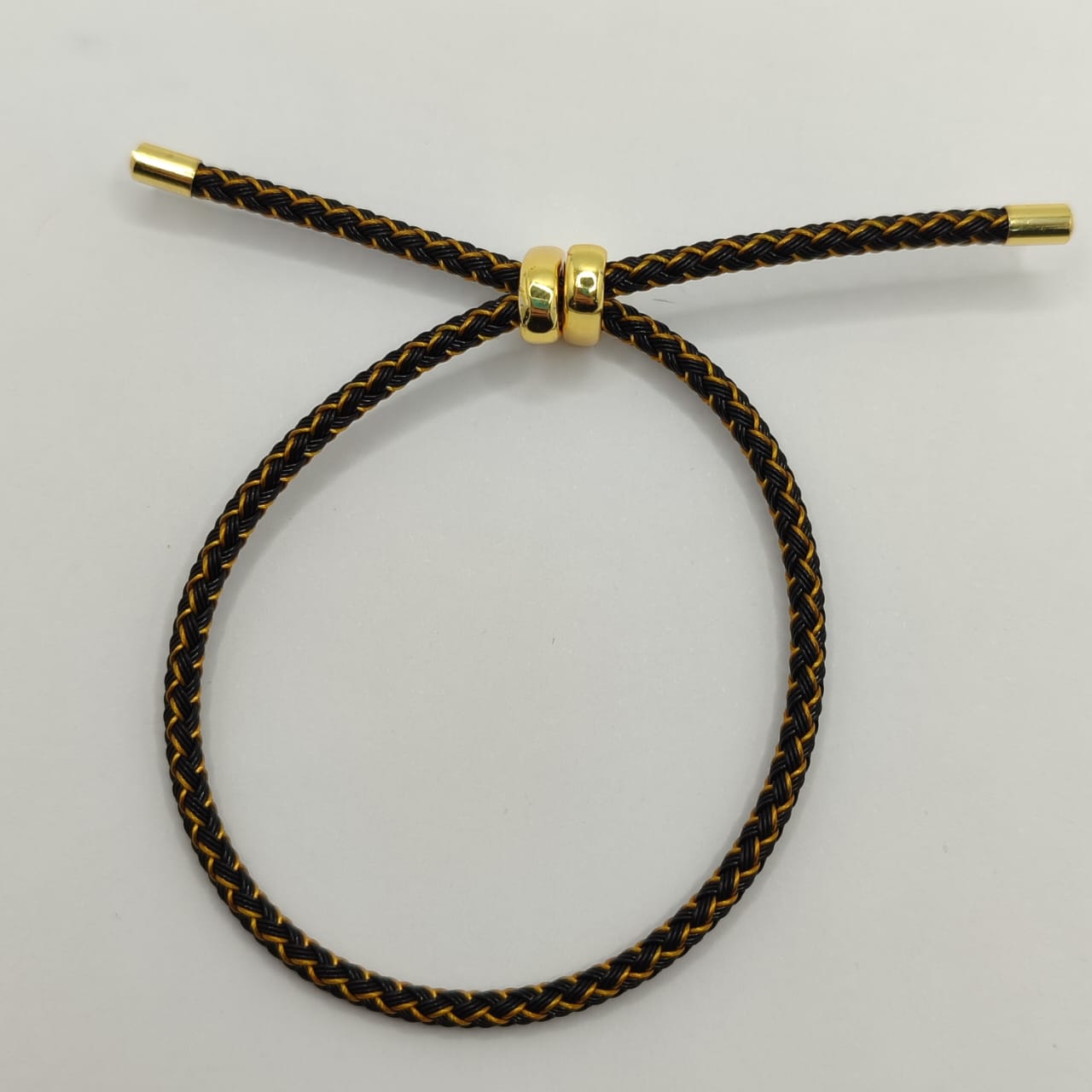 PULSERA AJUSTABLE NEGRO CON DORADO