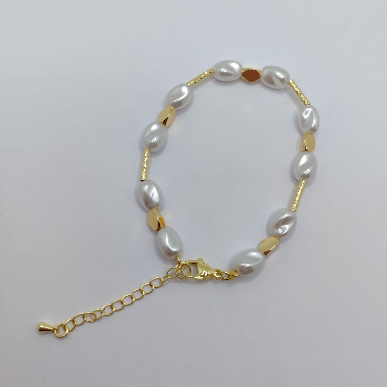 PULSERA DE PERLA IRREGULAR 7MM CON TUBITO SEPADOR