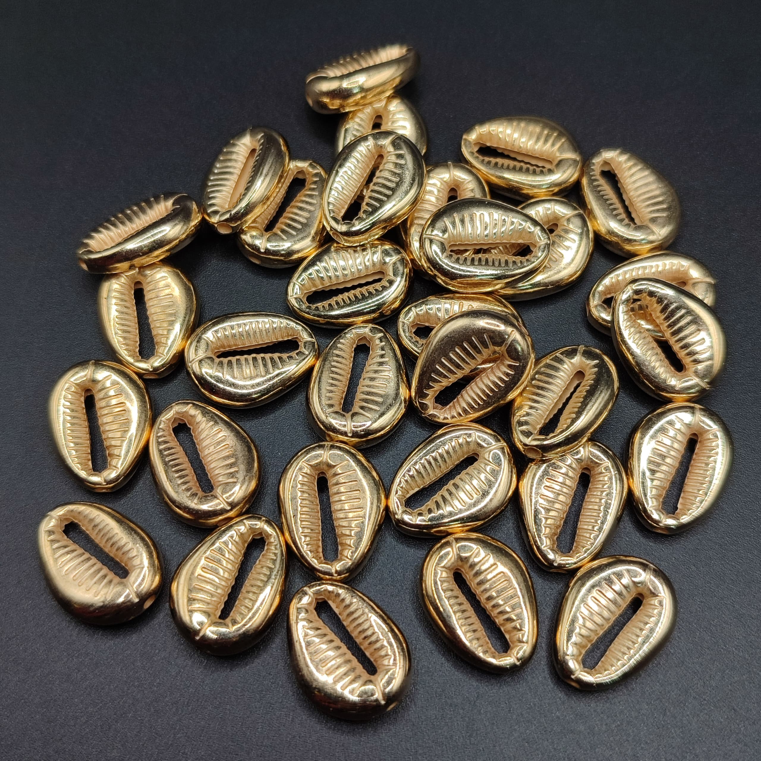 BOLSA 8 UND CARACOLES DORADOS