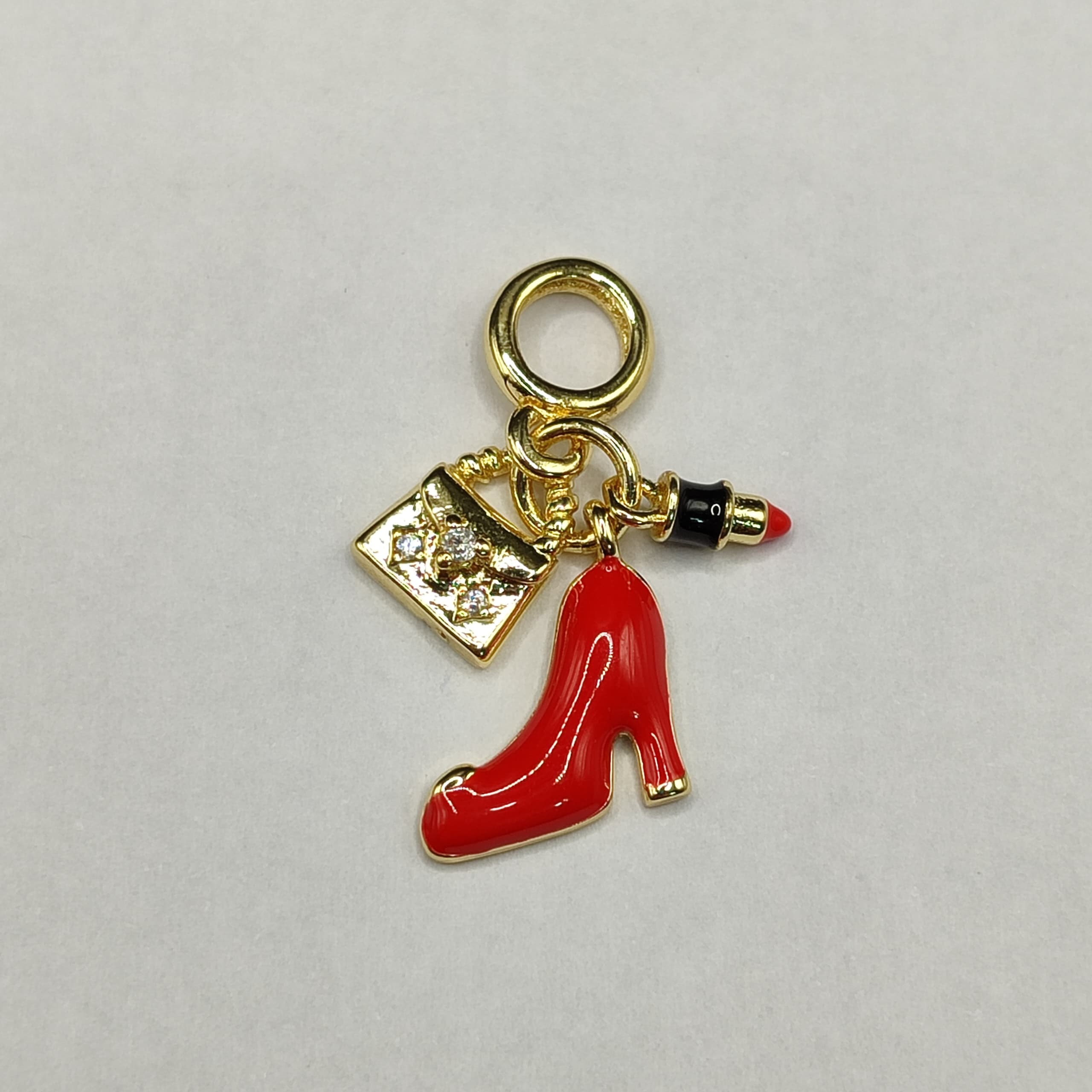DIJE DE PANDORA DE TANCON,CARTERA Y PINTA LABIOS
