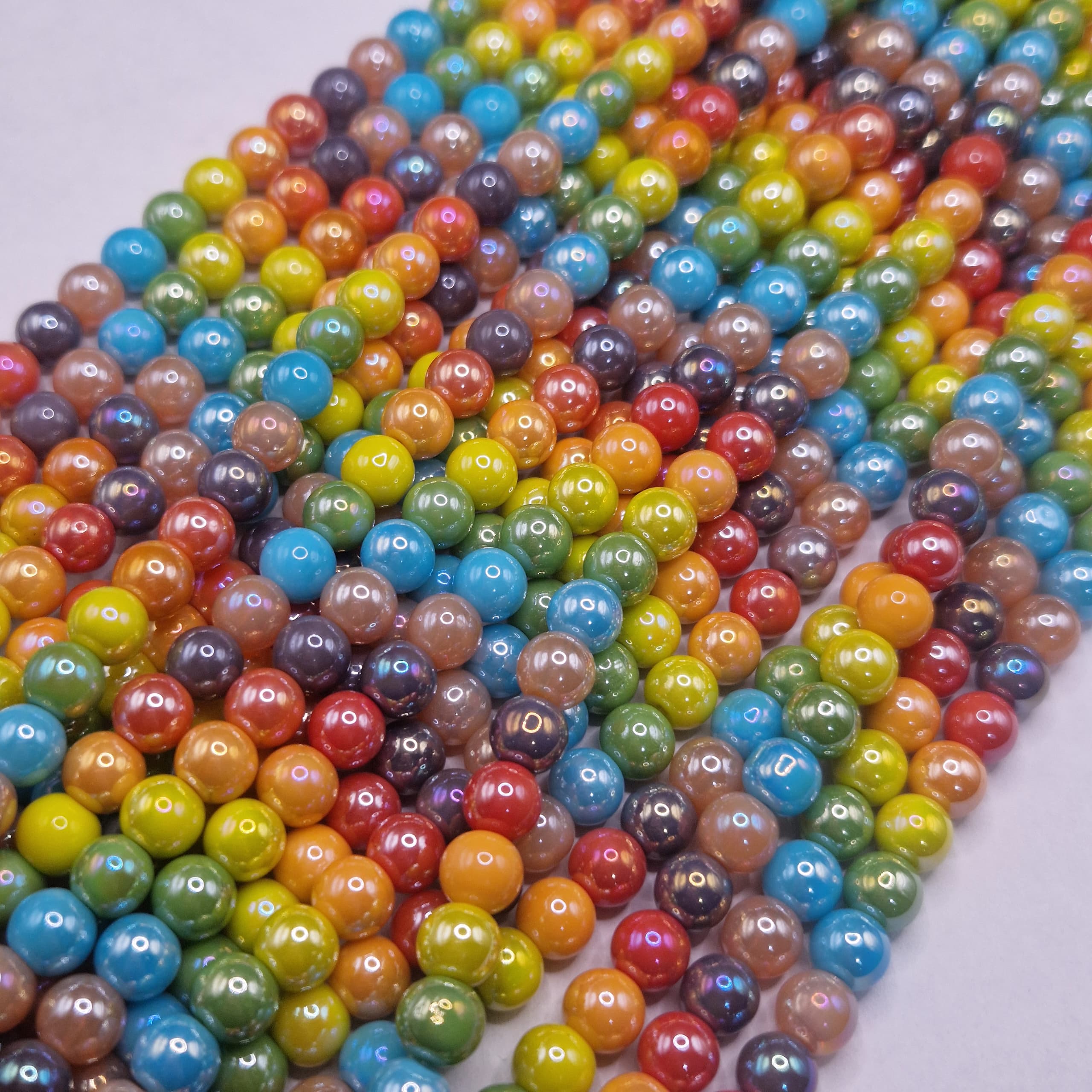 TIRA ESFERA DE COLORES TORNAZOLADA CLARA