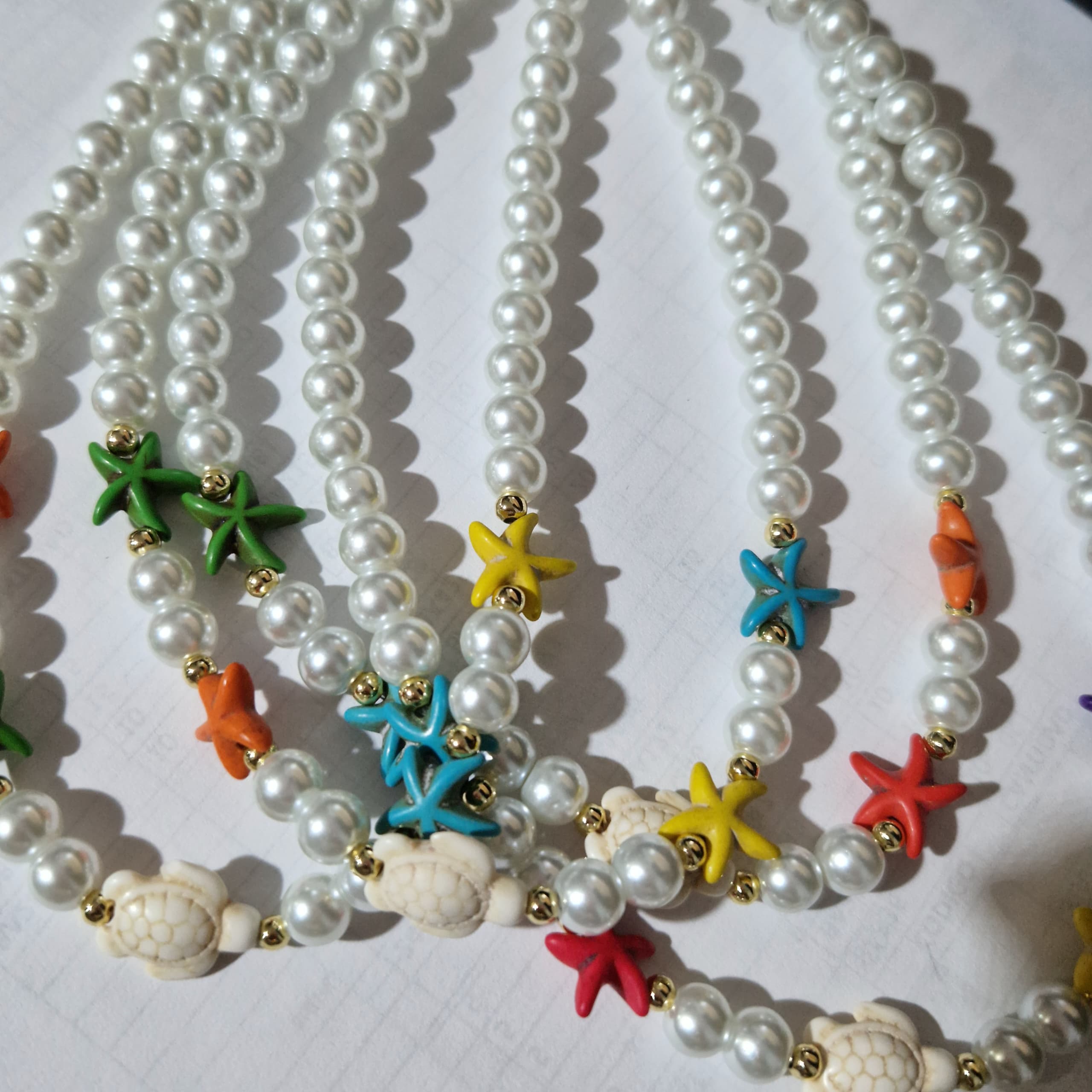 COLLARES DE PERLAS CON ESTRELLAS Y TORTUGA