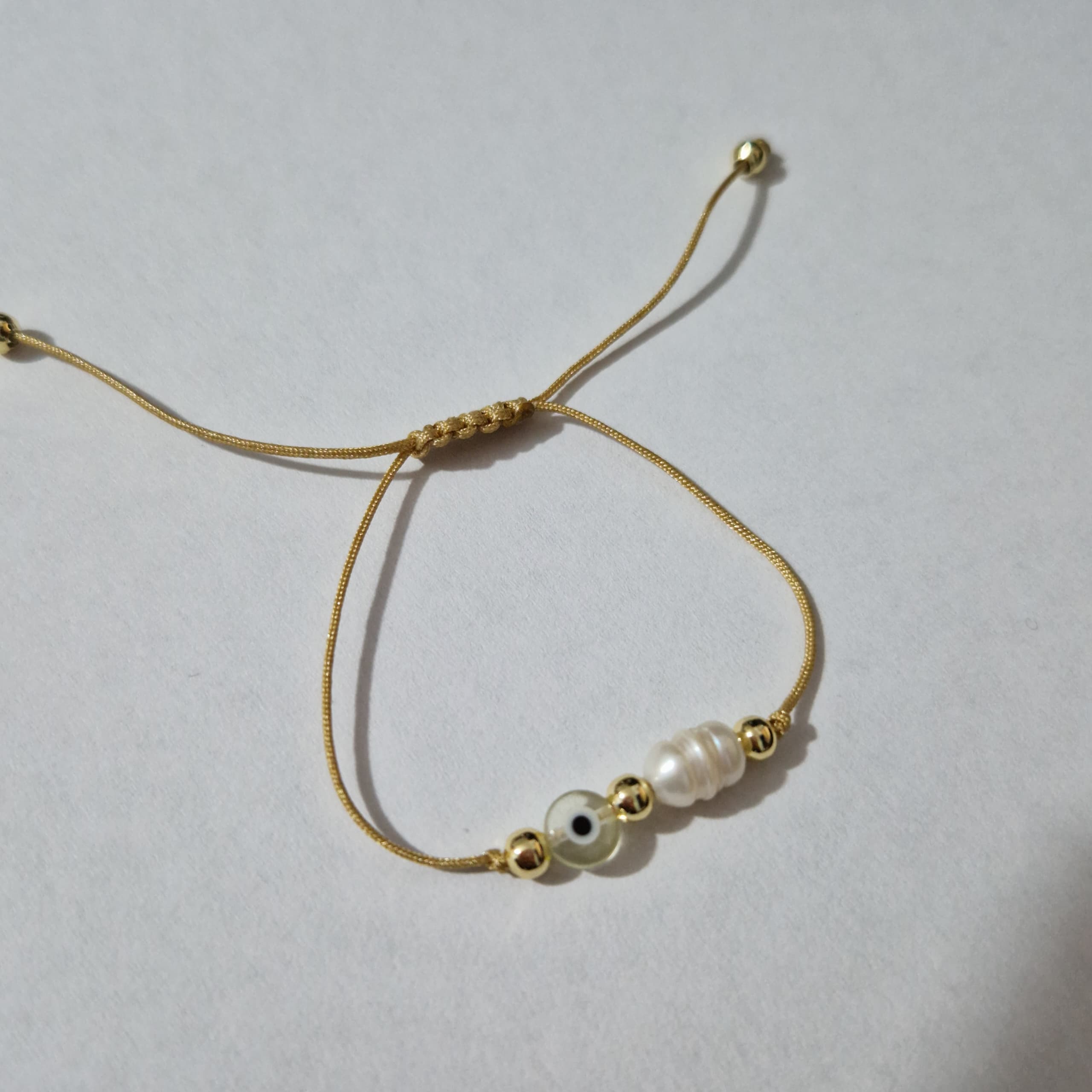 PULSERA HILITO PERLA Y OJO
