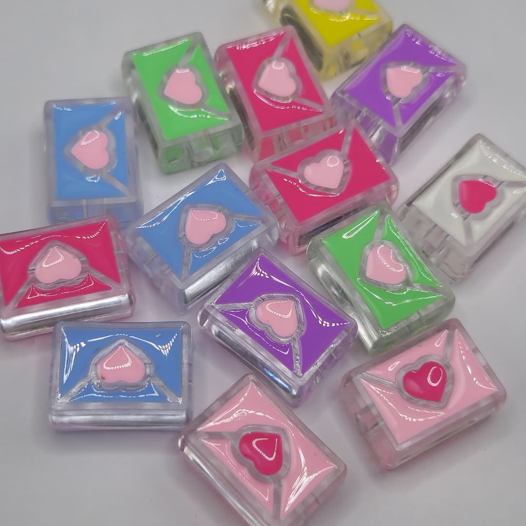 BOLSA 4 UND SOBRES TRANSPARENTES DE COLORES