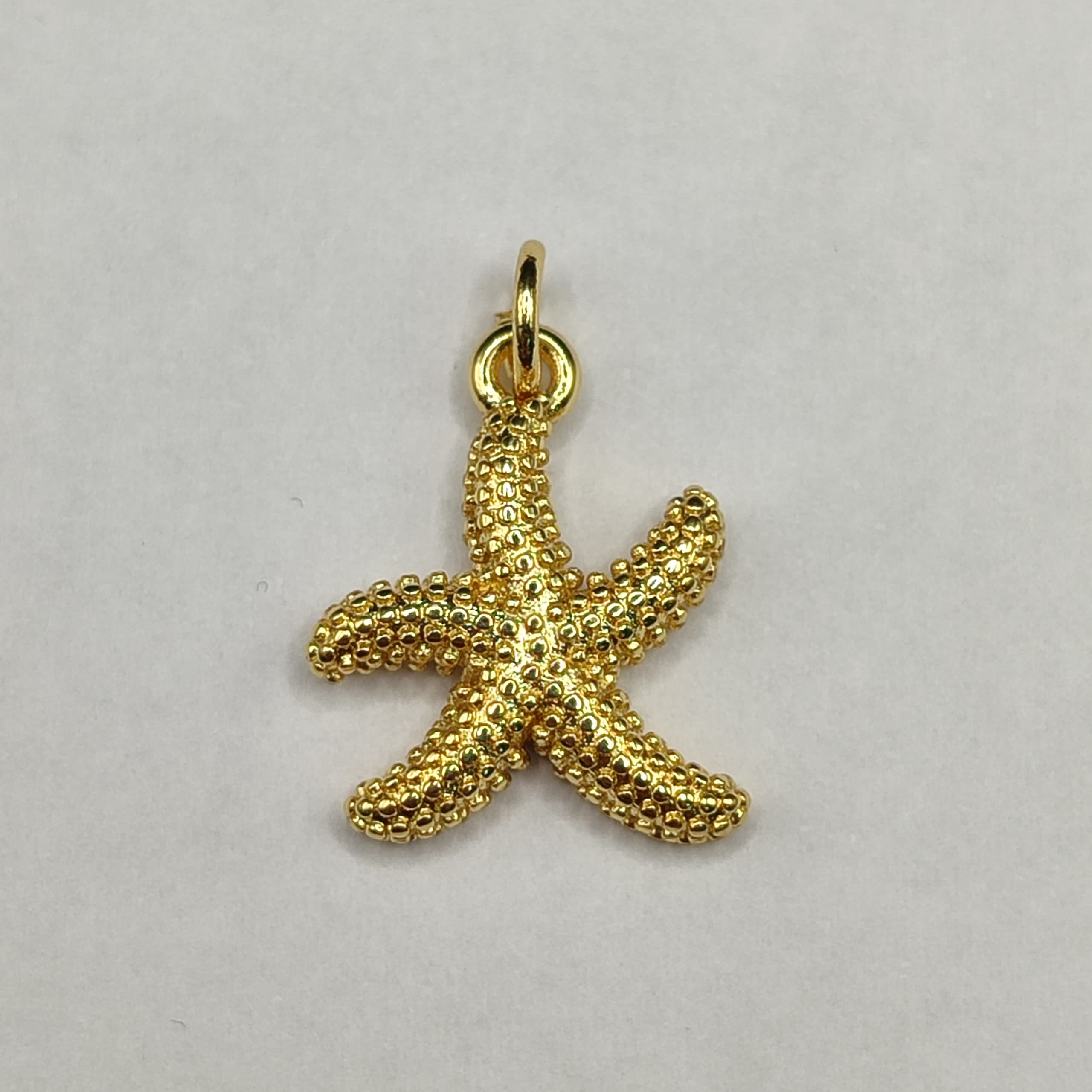 DIJE DE ORO CHINO ESTRELLA DE MAR