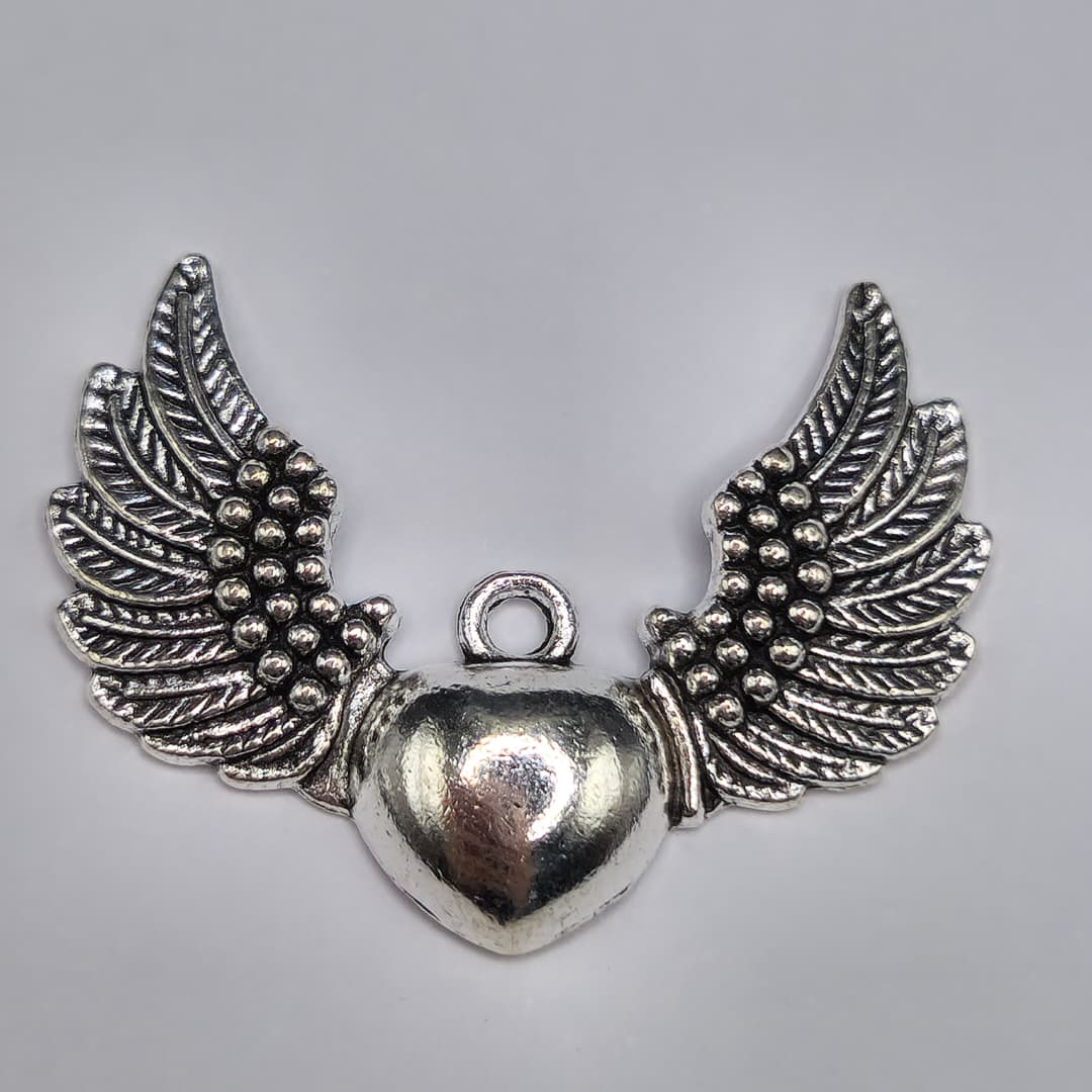 SILVER DIJE DE CORAZON CON ALAS 27X37MM