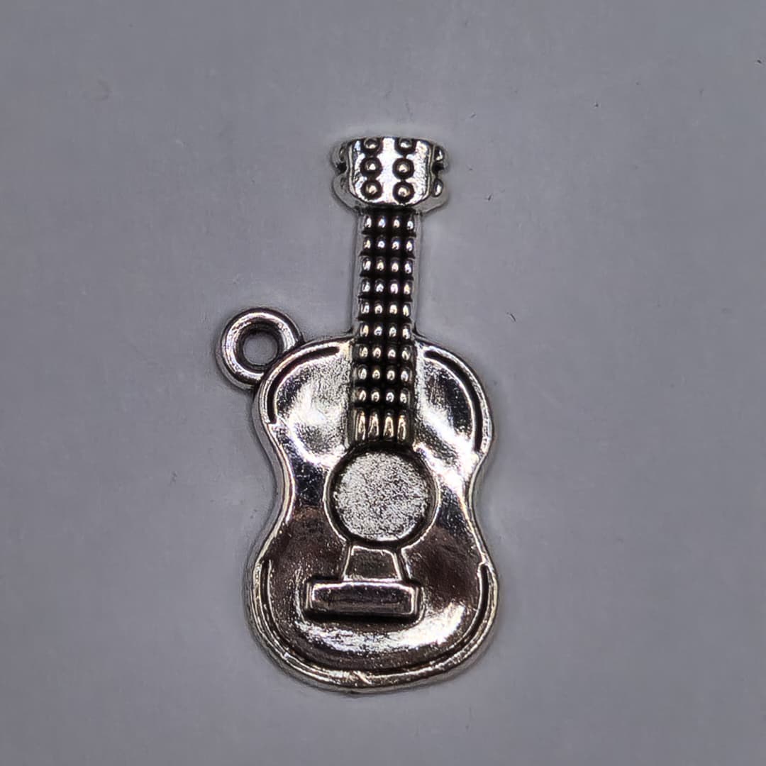 SILVER DIJE DE GUITARRA 12X25MM