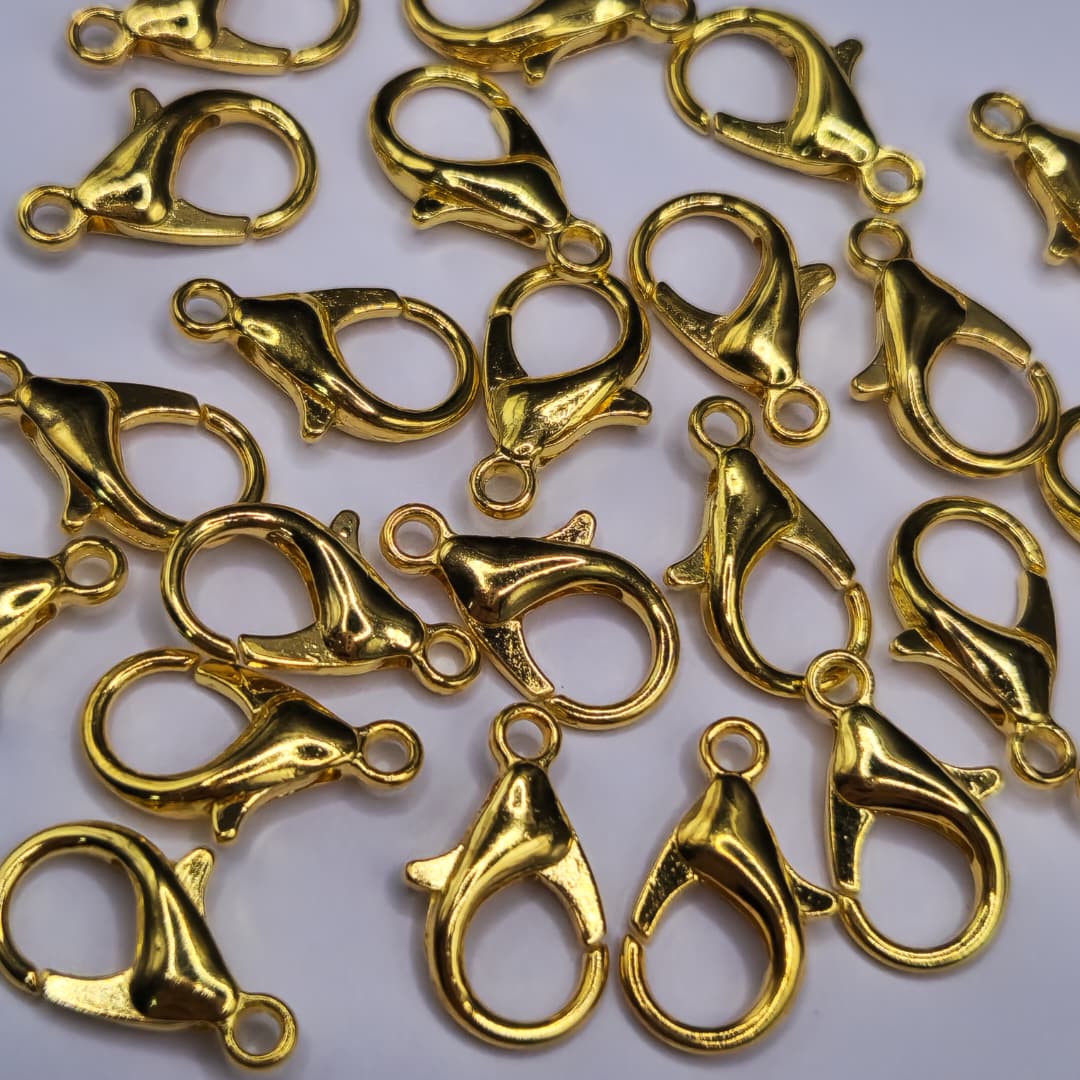 BOLSA 24 UND BROCHE PICO DE LORO 16MM DORADO FANTASIA