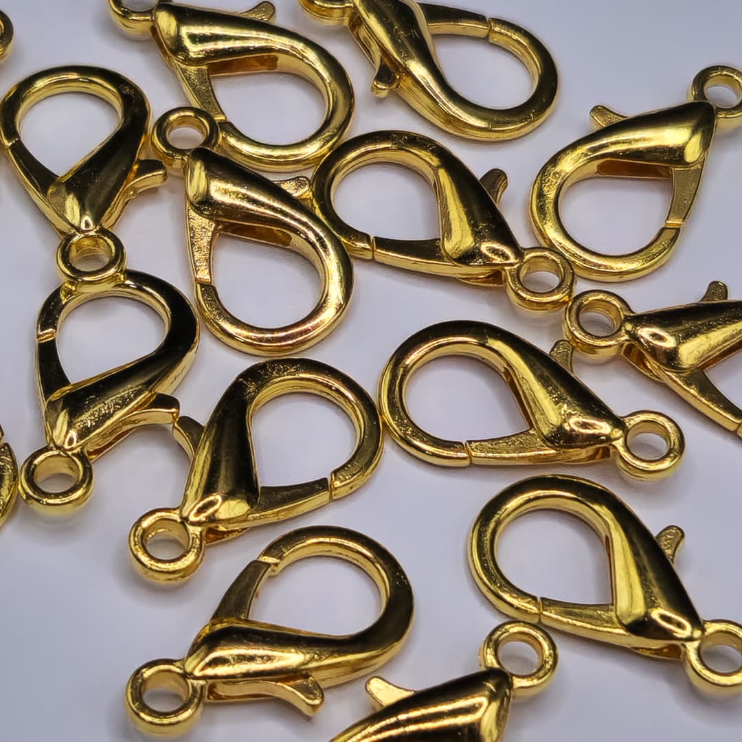 BOLSA 15 UND BROCHE PICO DE LORO 21MM DORADO FANTASIA