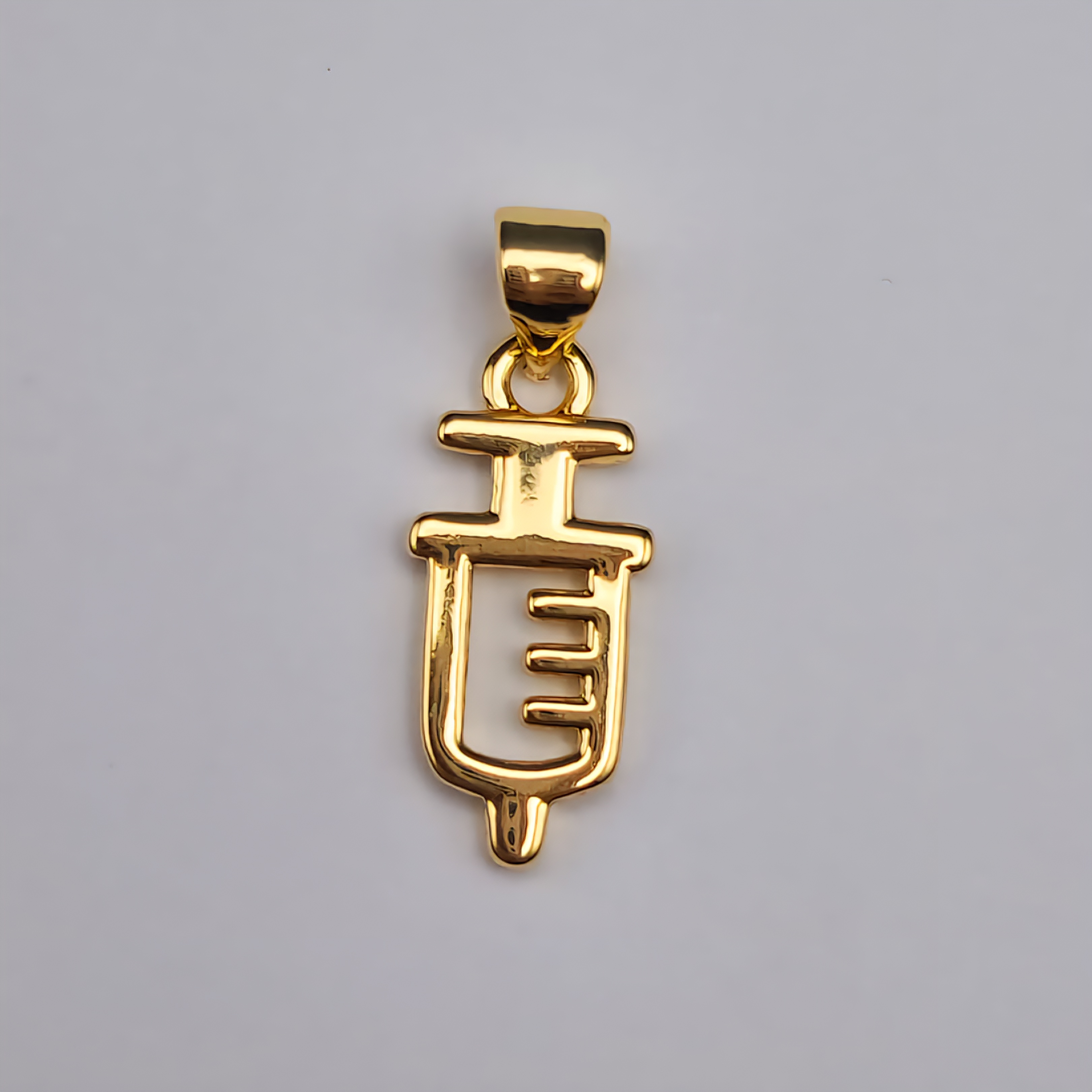 DIJE ORO CHINO INYECTADORA PEQUEÑA