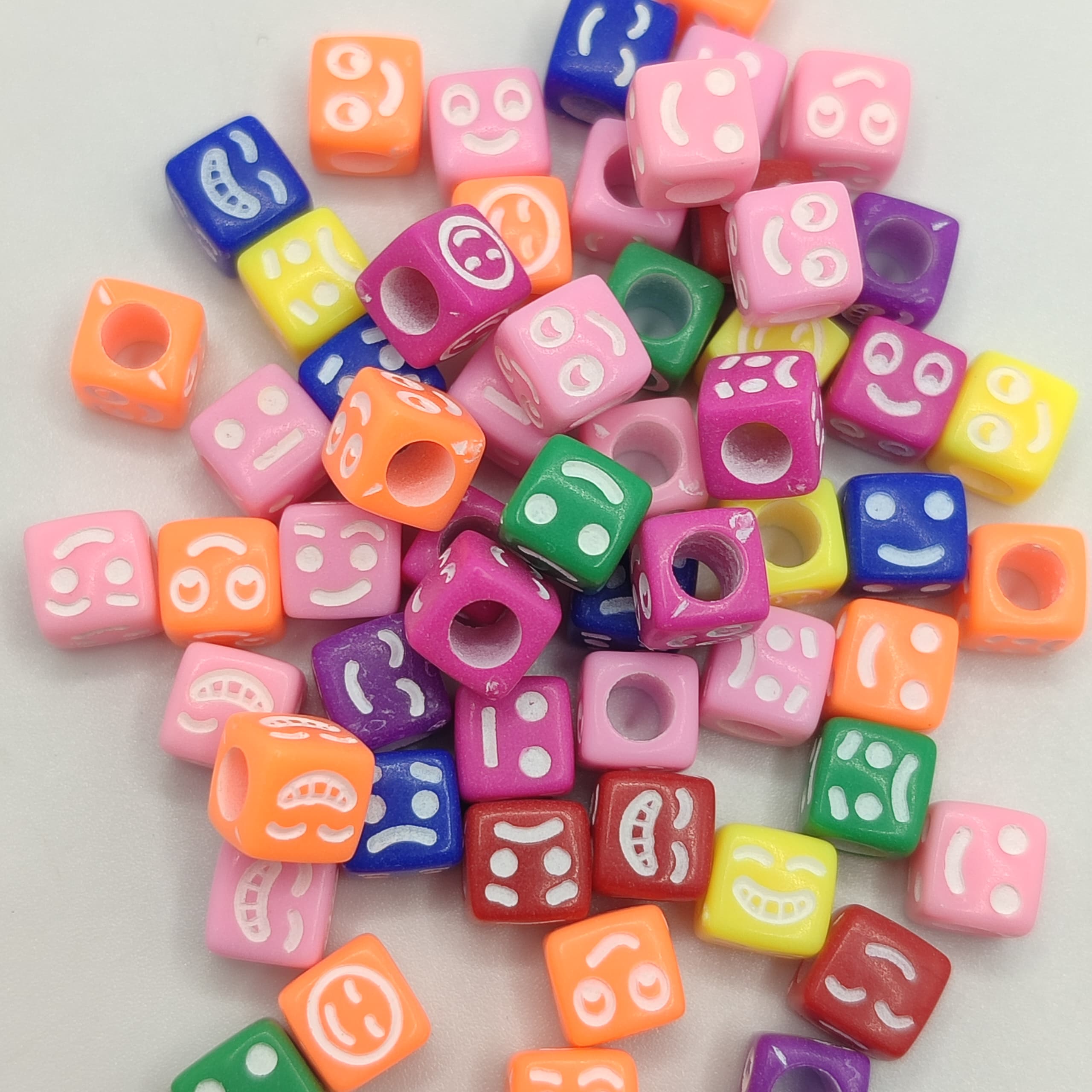 BOLSA 10G CUBOS DE CARITAS COLORES