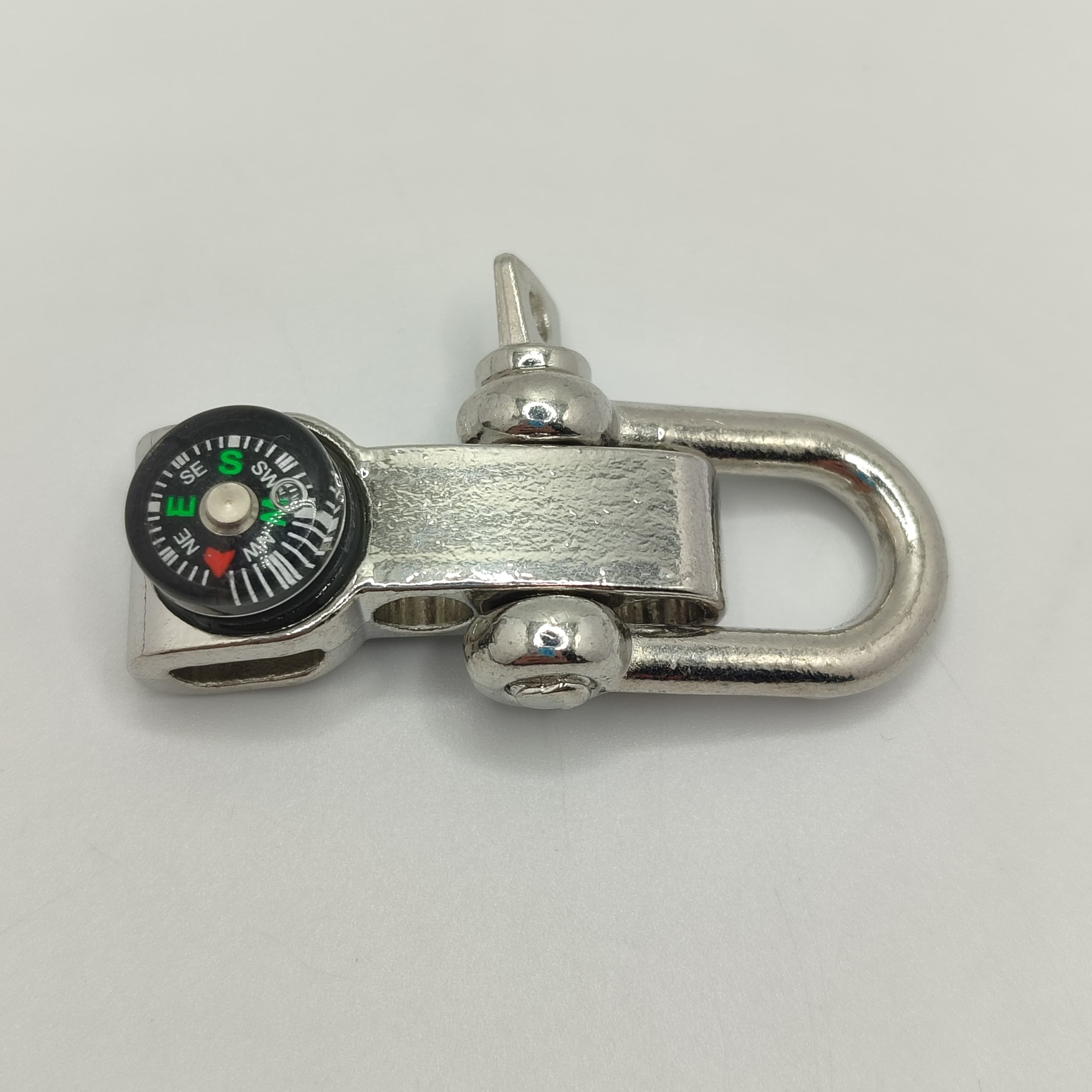 BROCHE DE NIQUEL COJN BRUJULA
