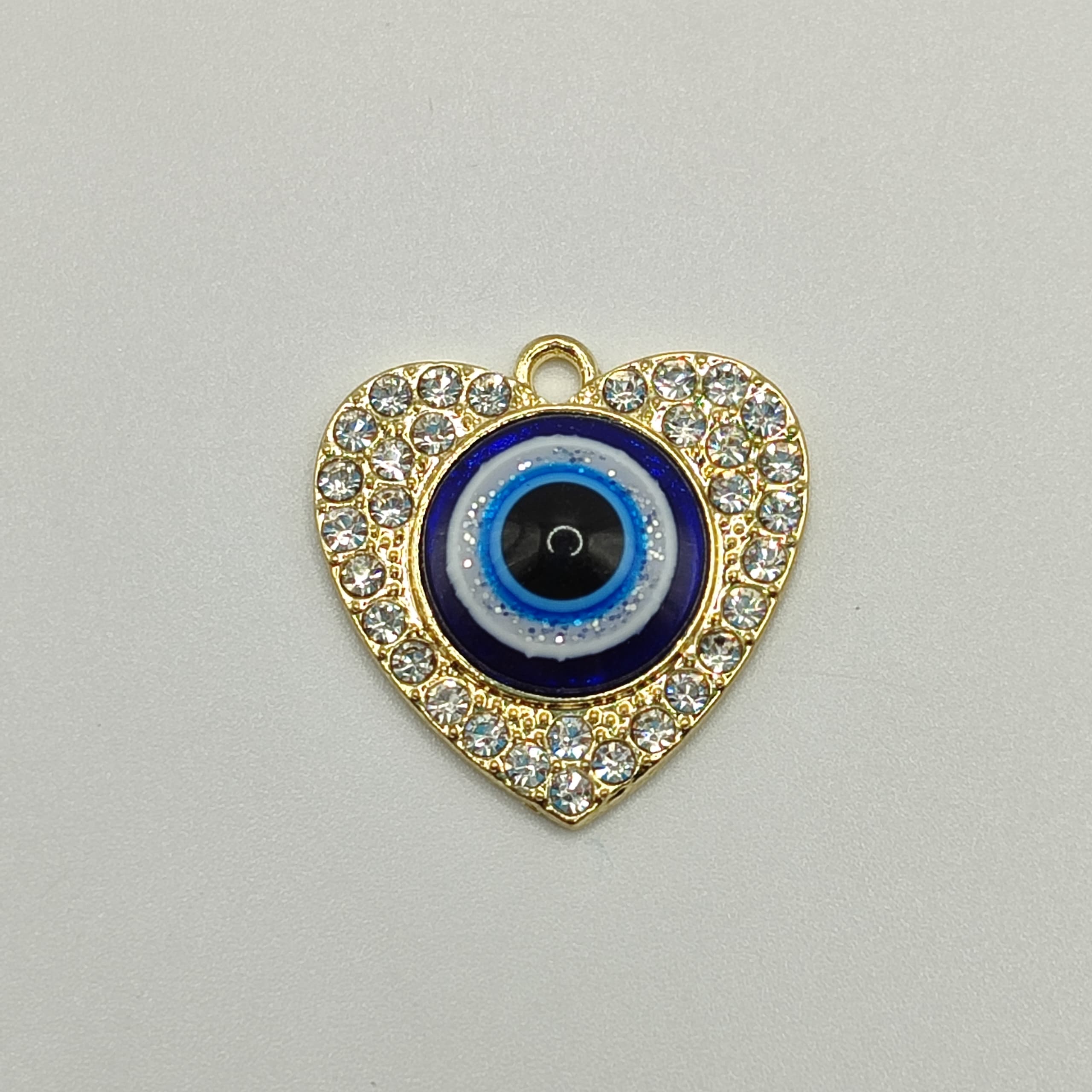 DIJE CIRCON CORAZON CON OJO  GRANDE