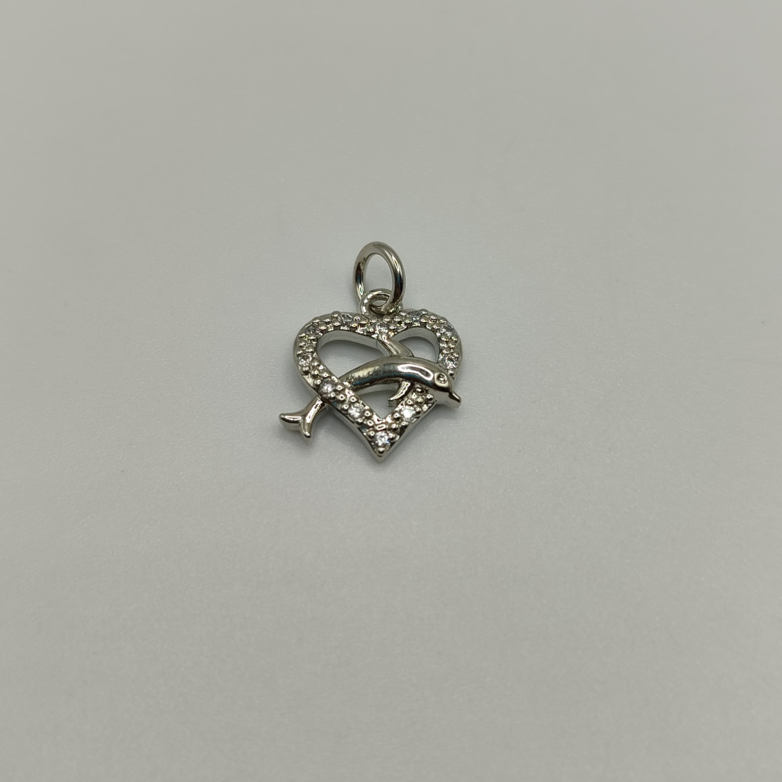 DIJE CIRCON CORAZON DELFIN PLATEADO