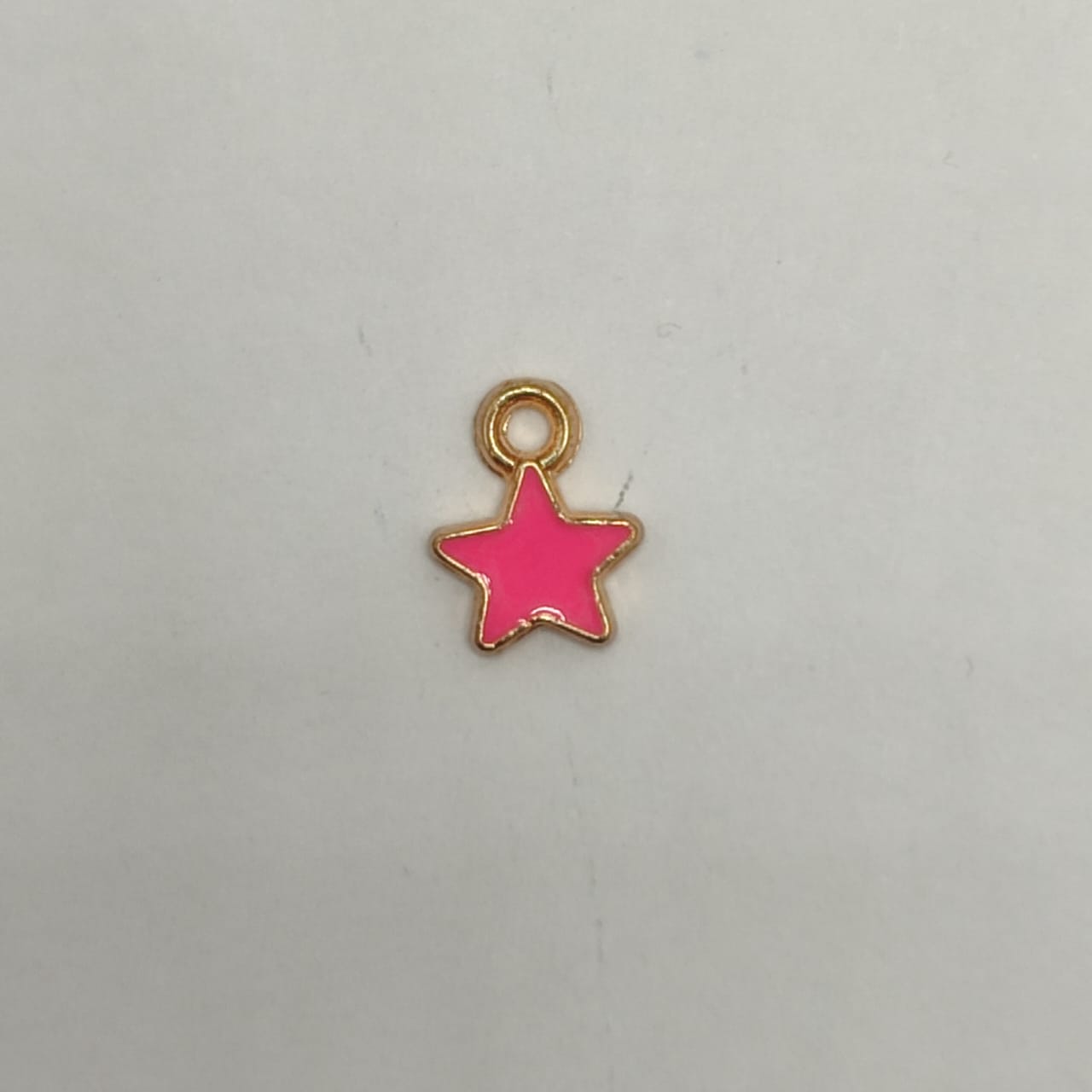 DIJE ESMALTADO ESTRELLITA FUCSIA