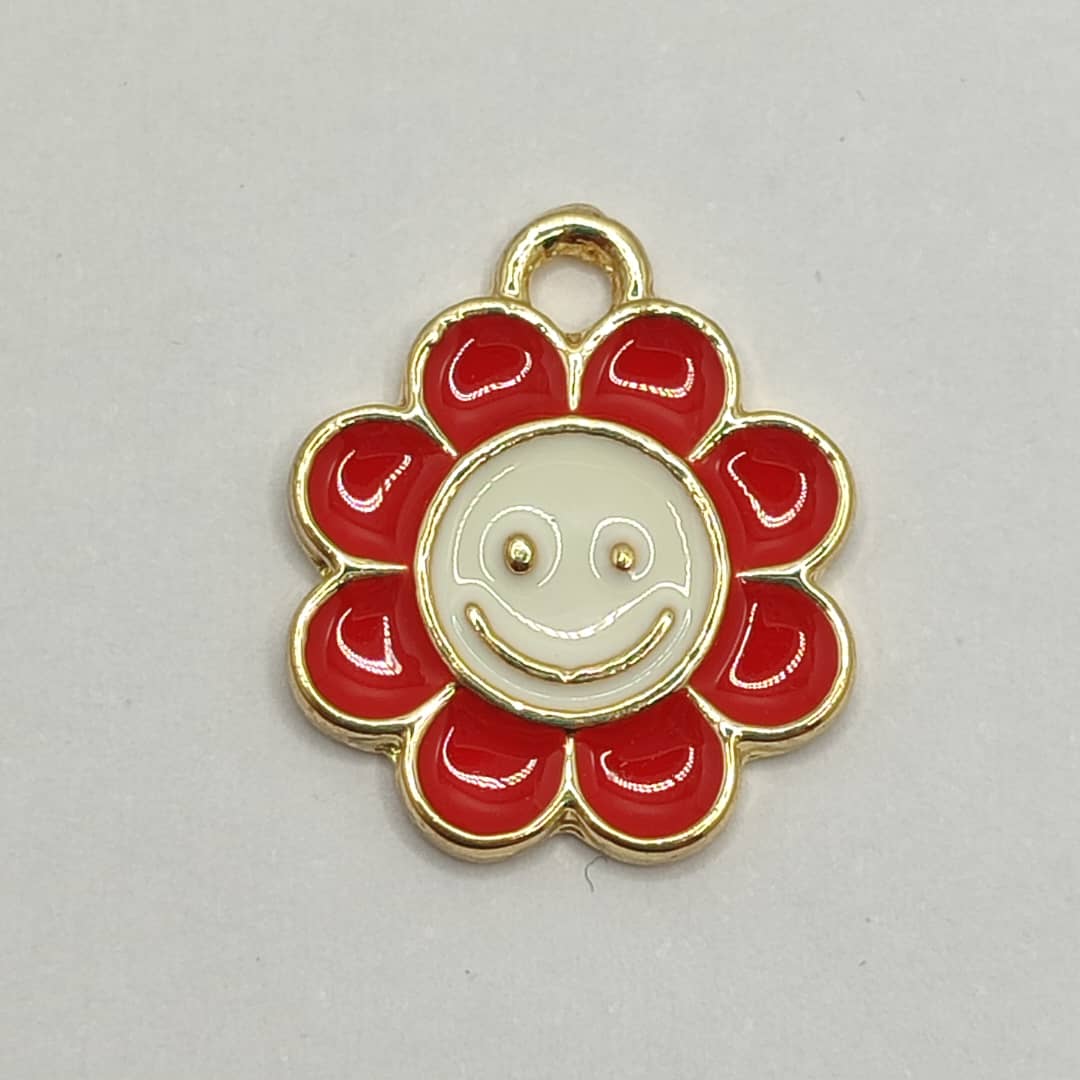 DIJE ESMALTADO FLOR CON SONRISA ROJA