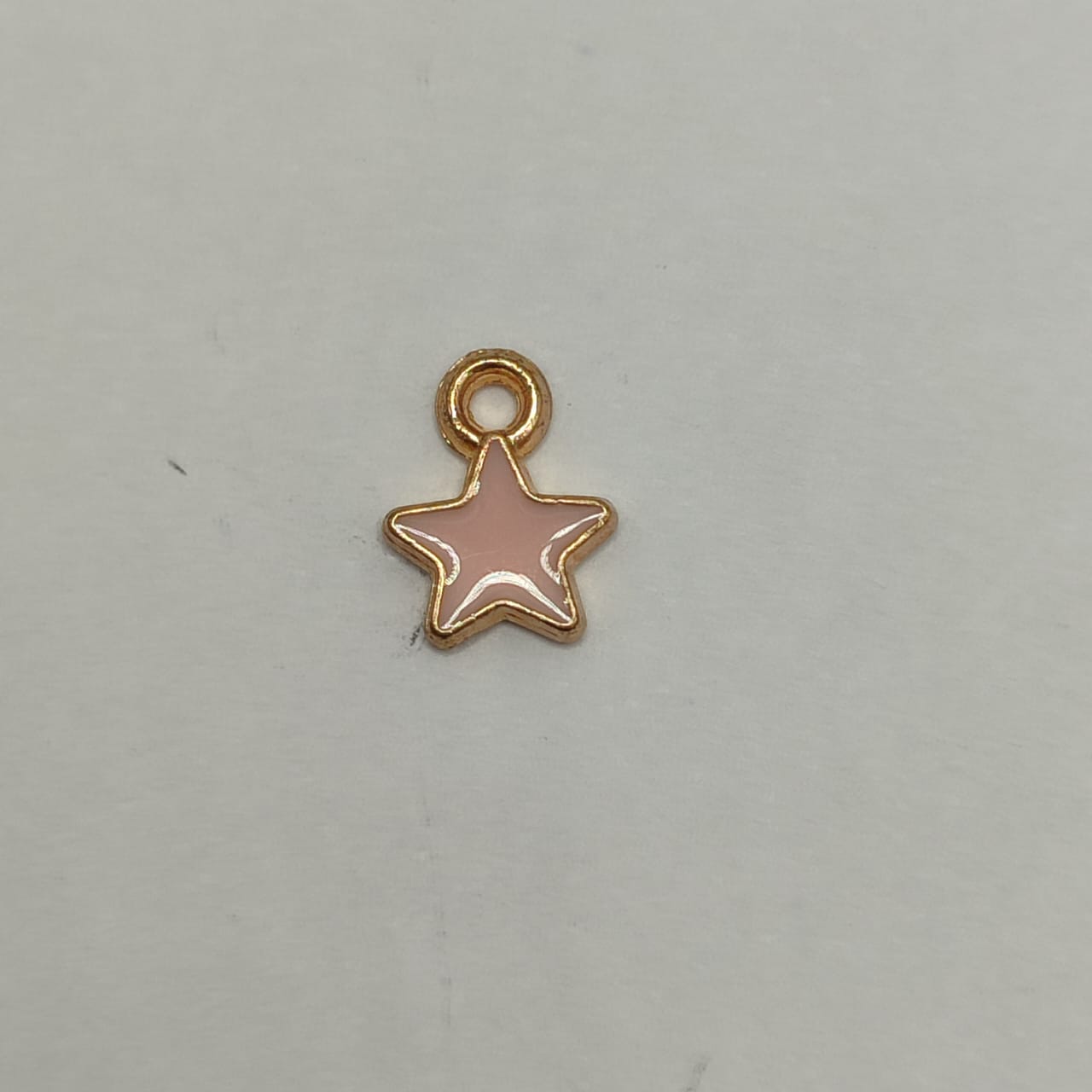 DIJE ESMALTADO ESTRELLITA ROSADA
