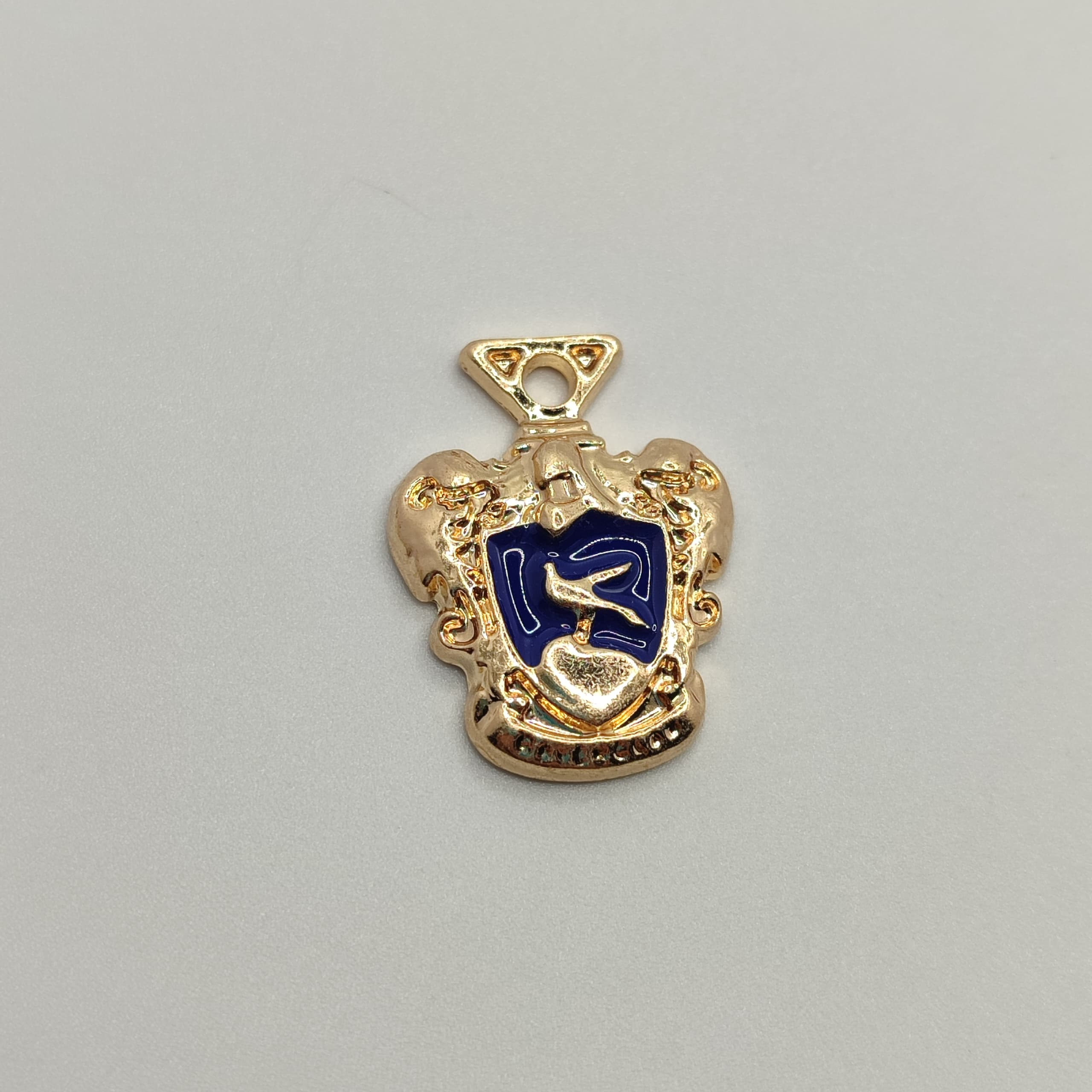 DIJE ESMALTADO MEDALLA HARRY PO TTER AZUL