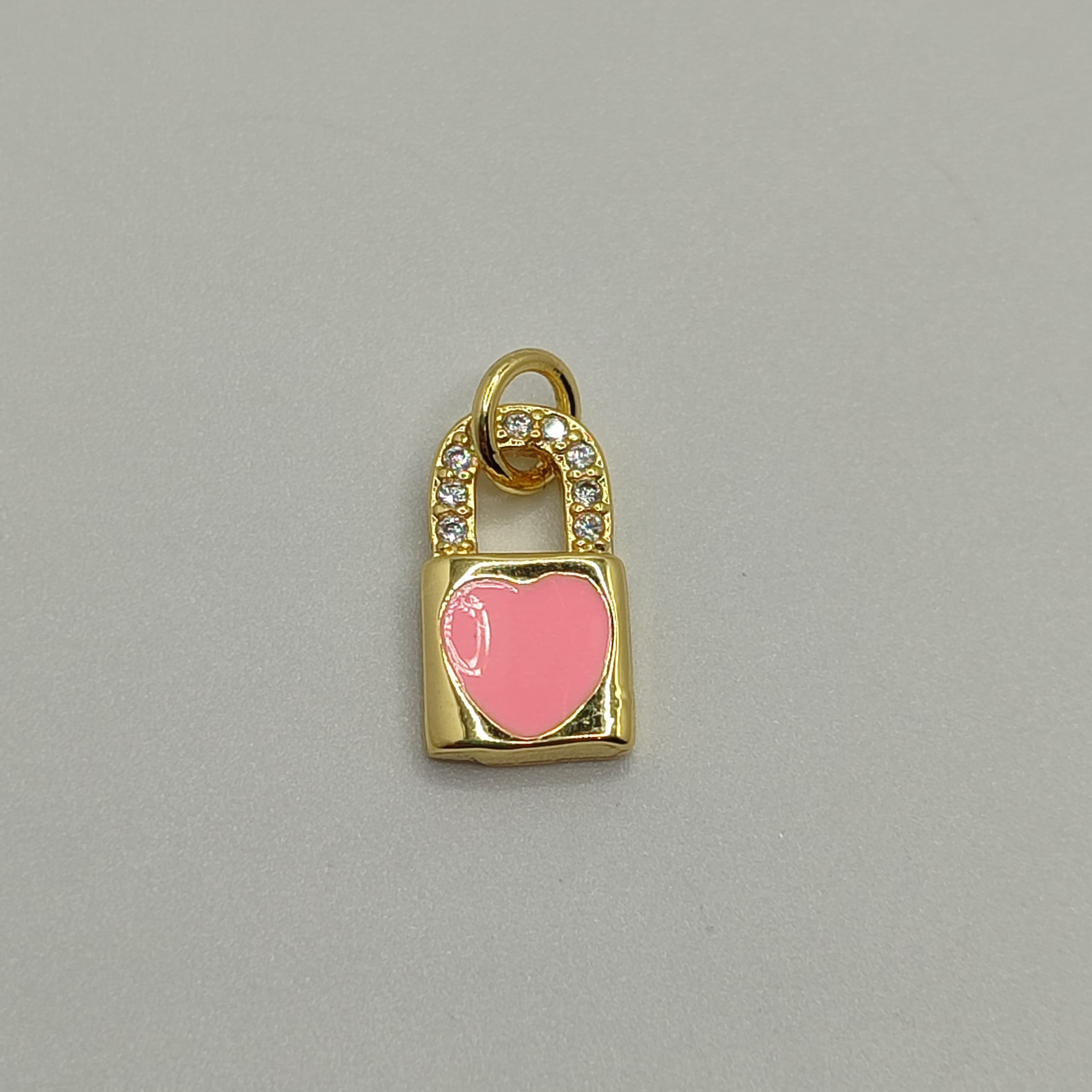 DIJE ESMALTADO CANDADO ROSADO CON CIRC