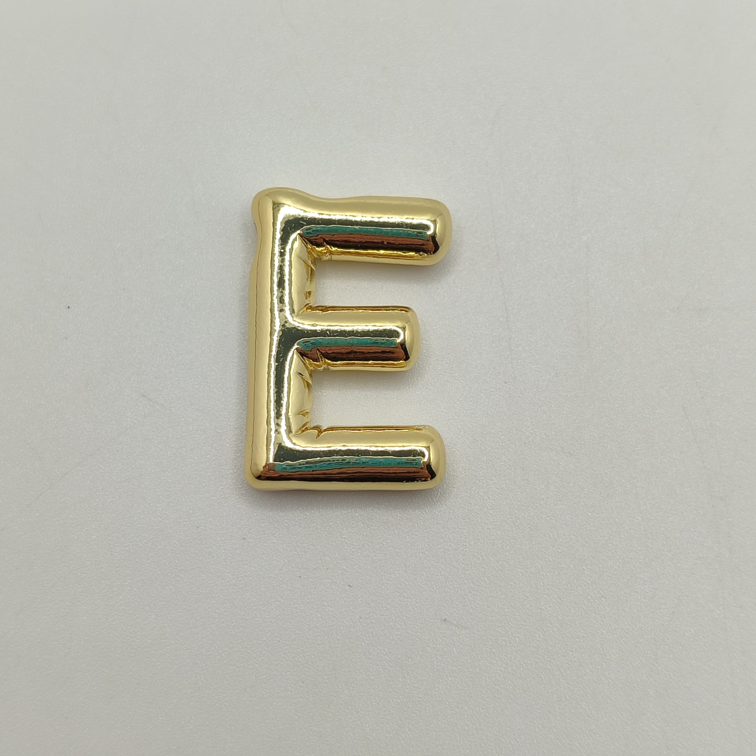 ORO CHINO LETRA E