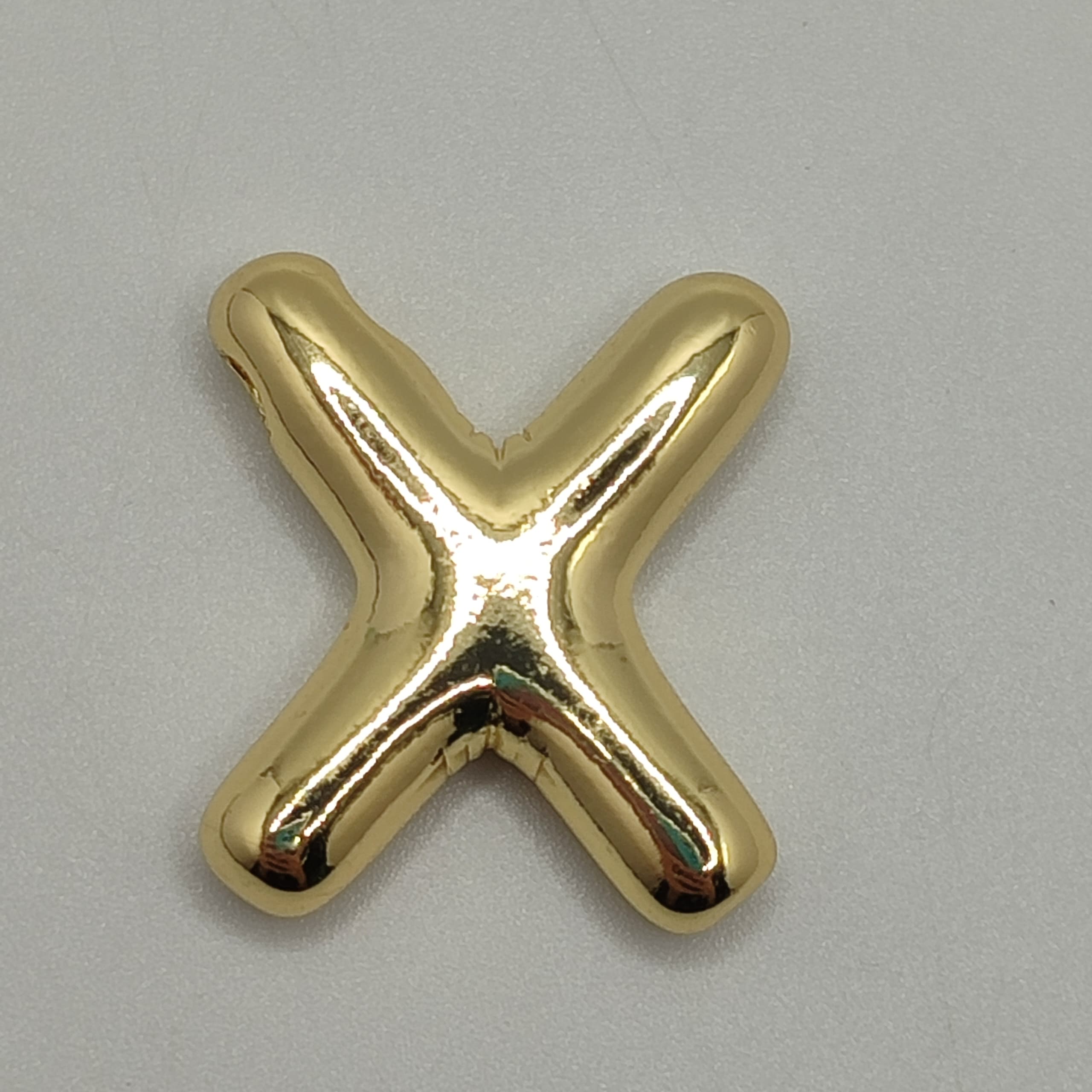 ORO CHINO LETRA X