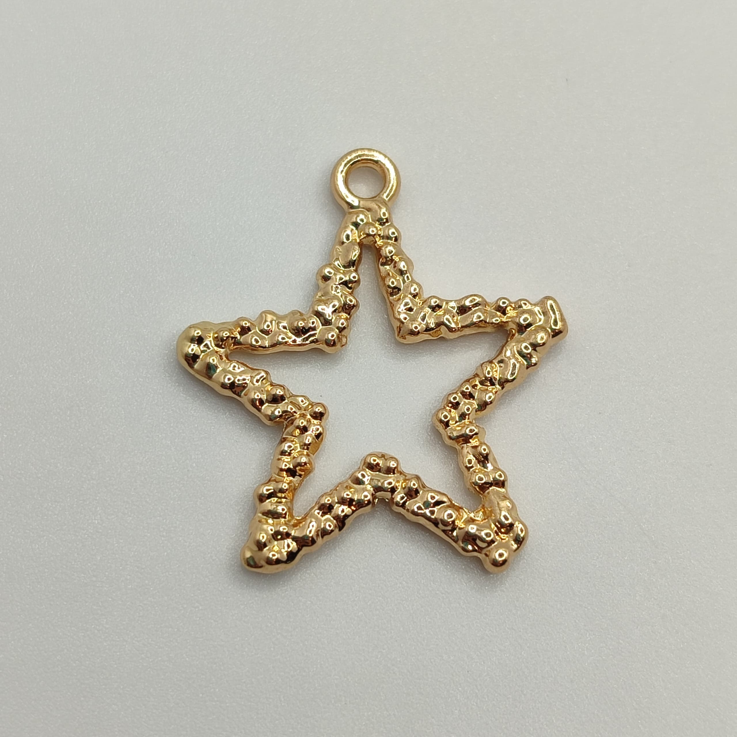ORO CHINO DIJE ESTRELLA HUECA