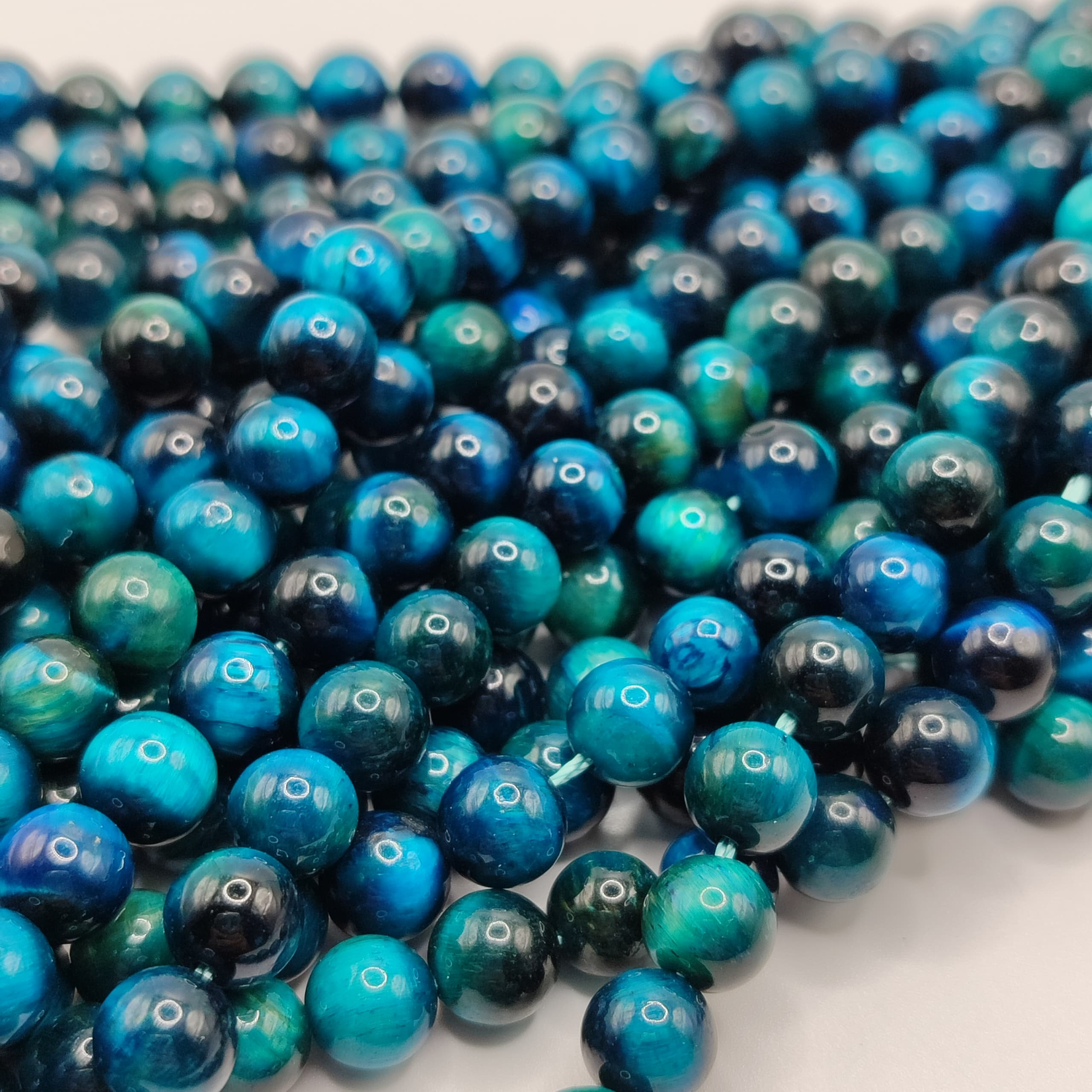 PIEDRA OJO DE TIGRE AZUL CLARO 8M M
