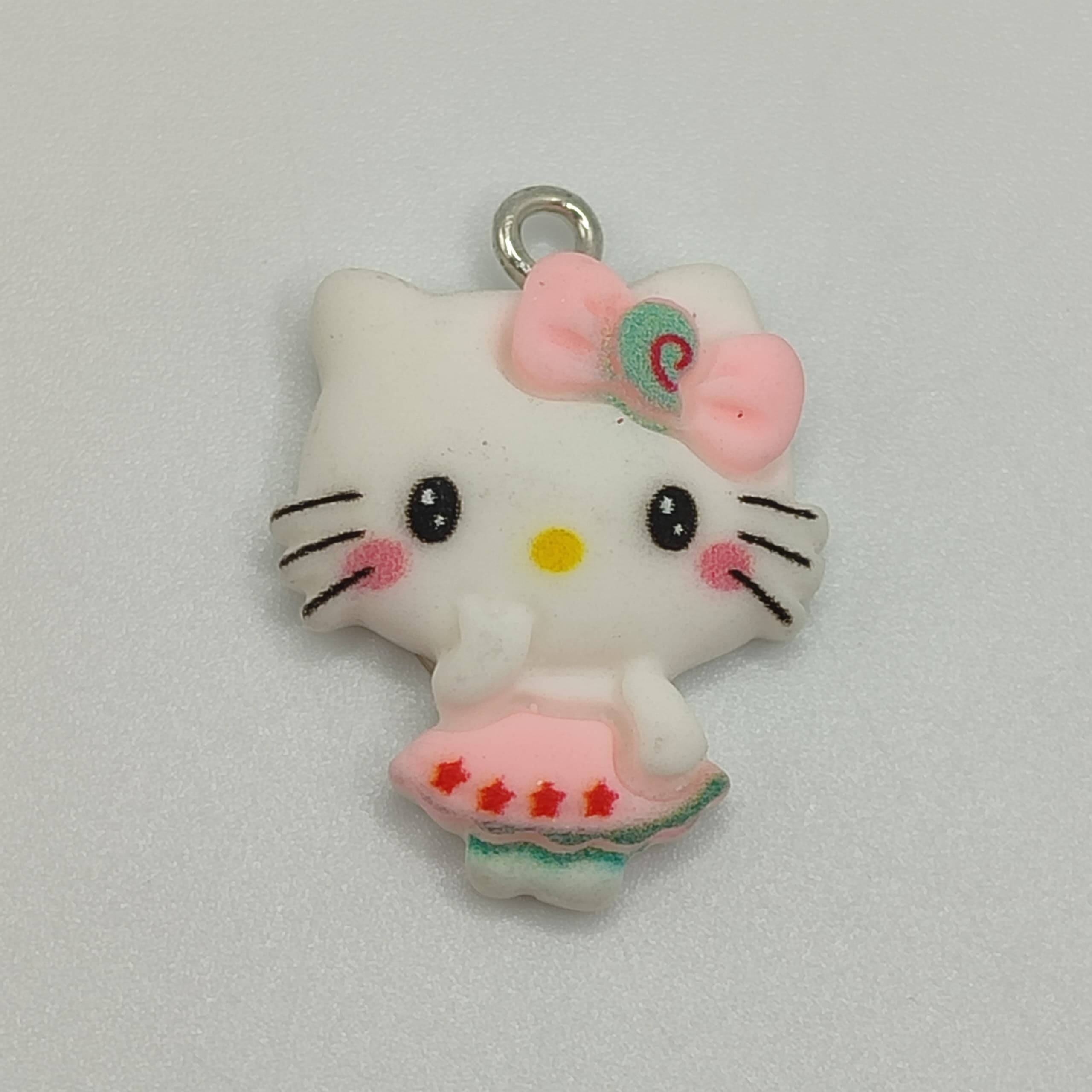 DIJE HELLO KITTY CON VESTIDO ROSA ESTRELLA