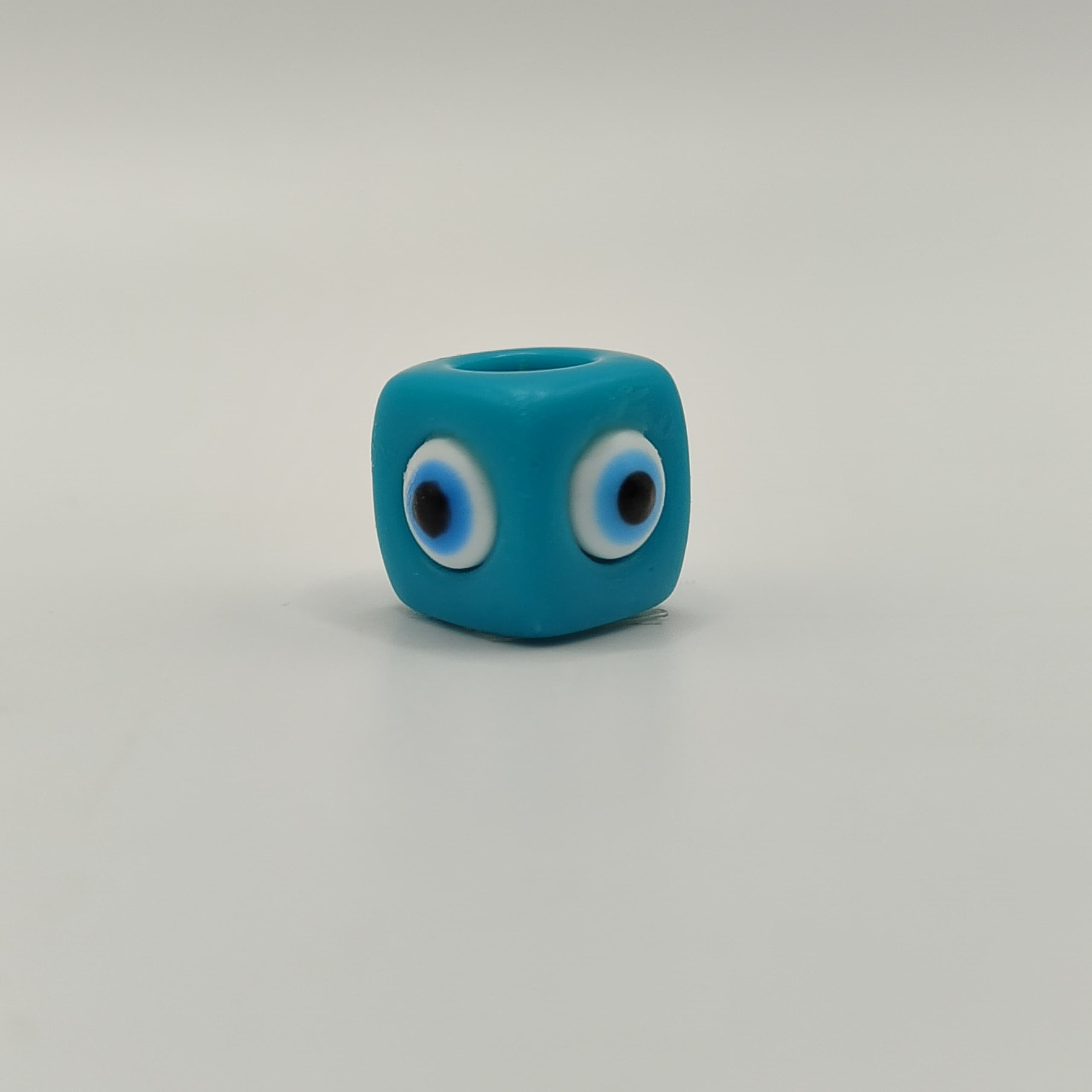 RESINA OJO CUBO TURQUESA